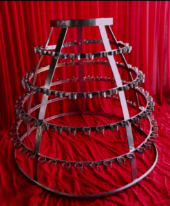 Custom multi level prop and performance rig setup against red backdrop in South Florida showcasing creative event production staging by Aura Entertainment